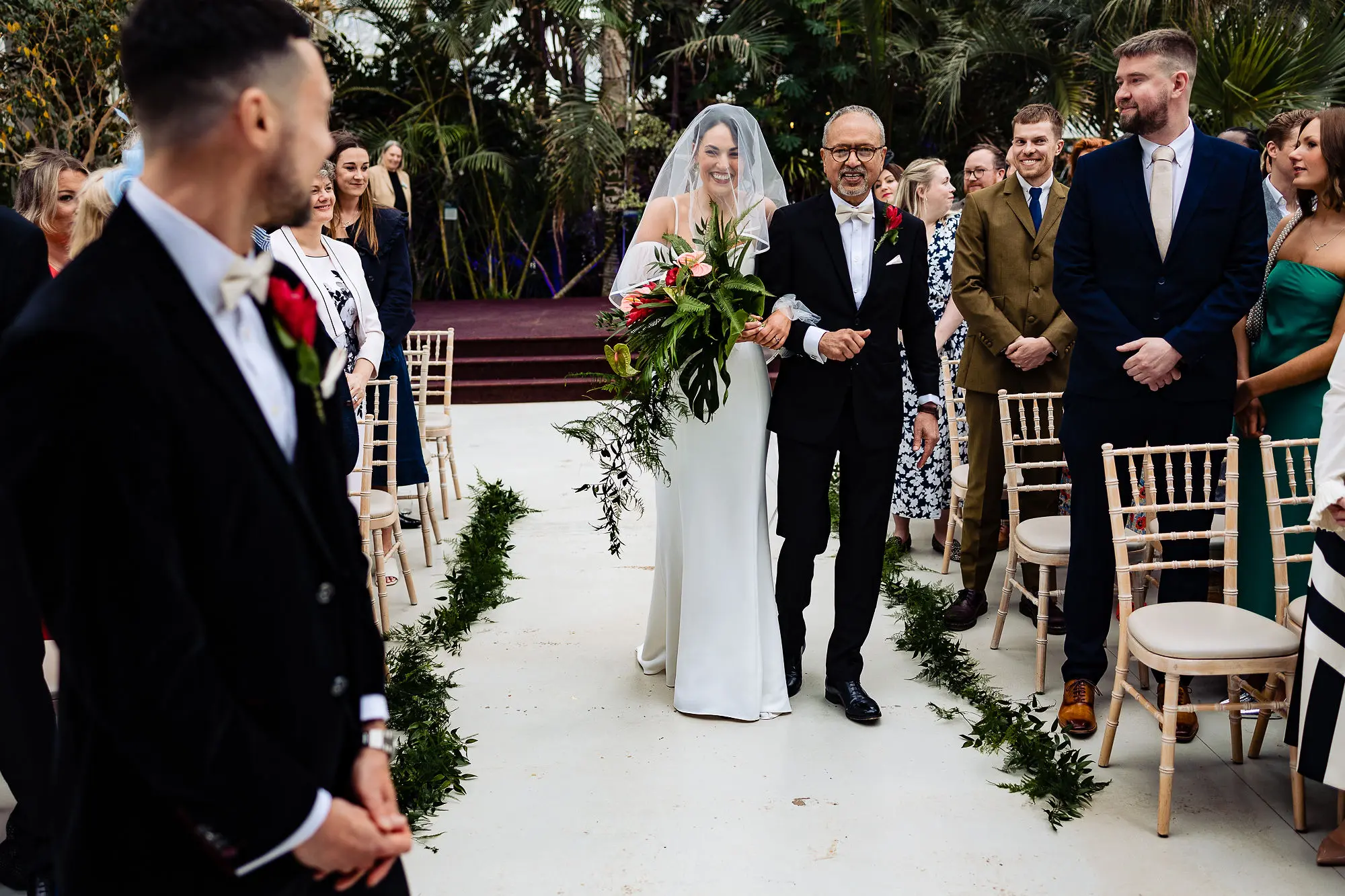 Ceremony flowers at the Palm house Liverpool that can be repurposed at the reception